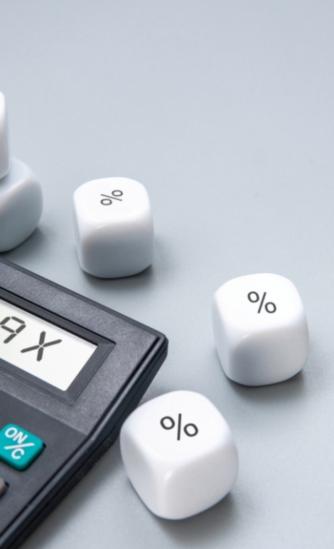 a-calculator-with-the-word-tax-displayed-on-its-2024-11-21-19-40-12-utc