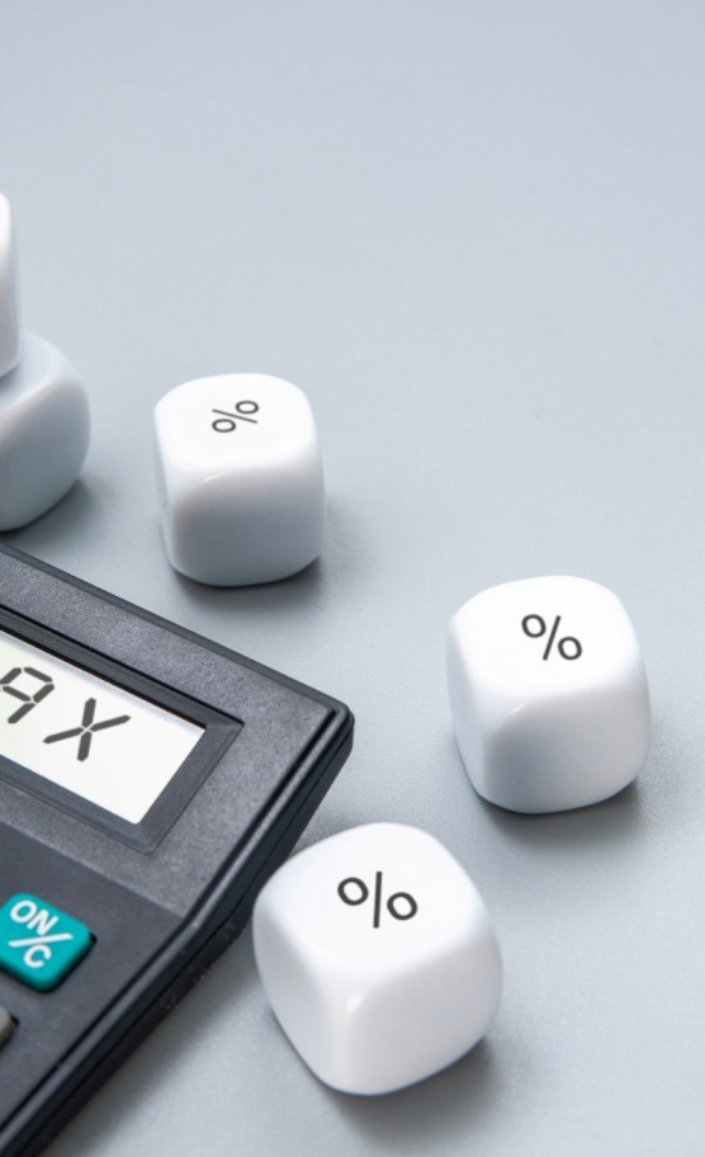 a-calculator-with-the-word-tax-displayed-on-its-2024-11-21-19-40-12-utc